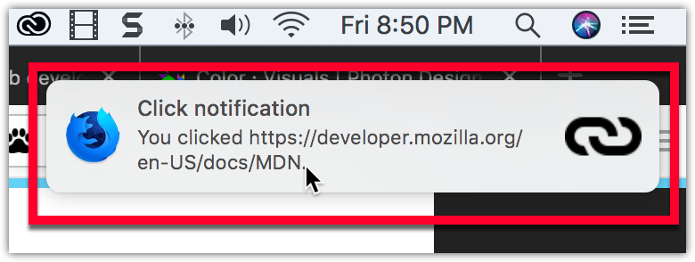 Example notification on macOS, located below the system clock, with a bold title reading "Click notification" followed by regular text reading "You clicked https://mdn.club.tw/en-US/docs/MDN". The notification has the Firefox Nightly logo on the left side, and a link icon on the right.