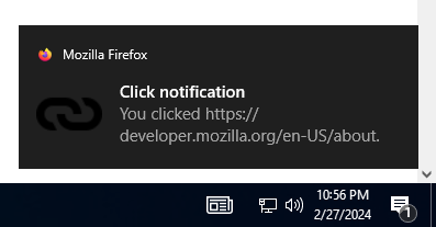 Example notification on Windows 10, located above the system clock, with a bold title reading "Click notification" followed by regular text reading "You clicked https://mdn.club.tw/en-US/docs/MDN". The notification has a small Firefox logo in the top left corner that is followed by "Mozilla Firefox", and a link icon to the left of the primary notification text.